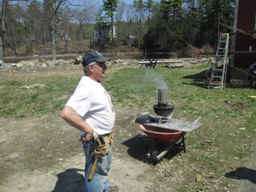 Richard Mauser Prepares the grill for lunch